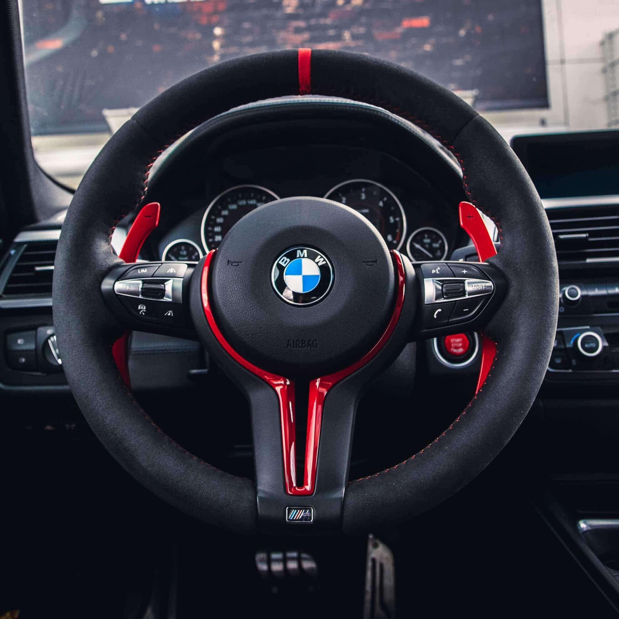 https://aulitzkyexhaust.de/media/cf/8e/22/1621322018/PaddleShifterz-BMW-F90-Compeition-carbon-fiber-paddle-shifters-red-2.jpg